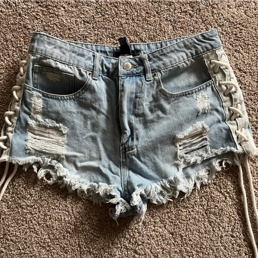 Brand new lace up jean shorts!! Size 27!